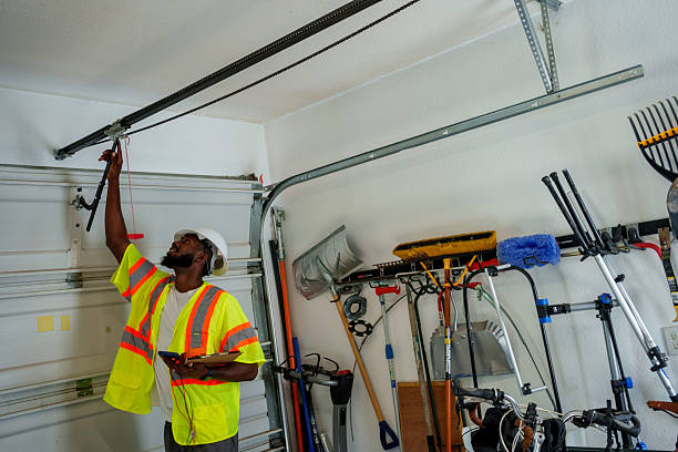 Professional Garage Door Panel Replacement technician working in Warrensville Heights, OH